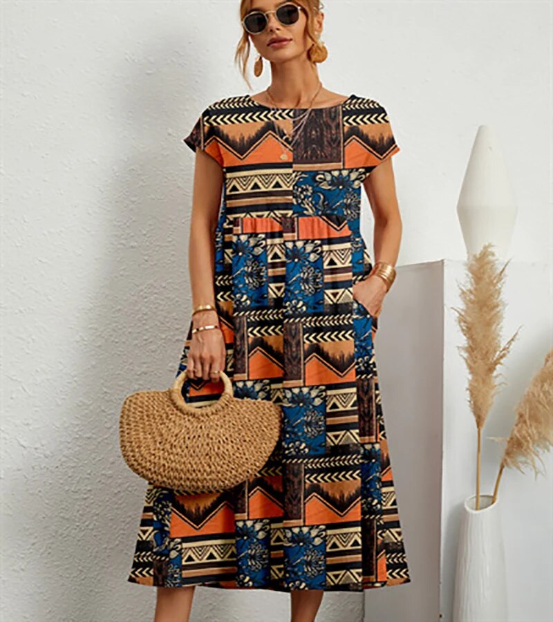 Give me a cotton dress with floral print and pockets. - Orange / XS